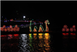 A Light Display of a Sea Serpent Wearing a Santa Hat